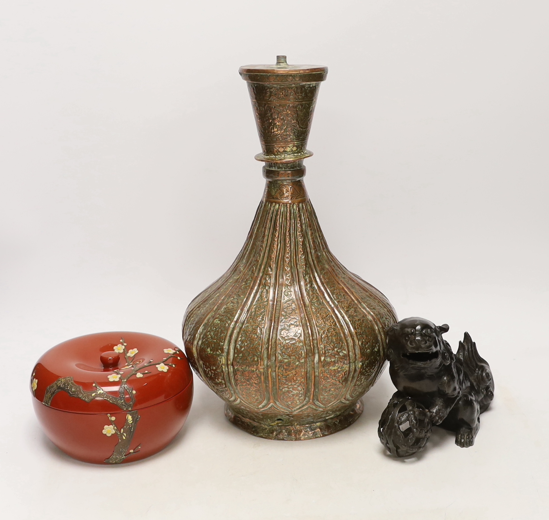 A Persian copper converted lamp, Chinese dog of Fo and a box and cover, tallest 34cm